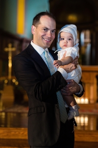 Father holding son at baptism