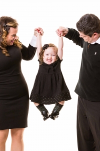 parents-swinging-baby-studio