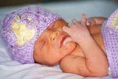 baby-in-lavender-cap-photo