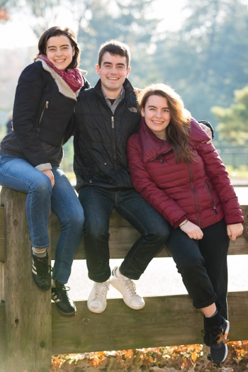 Siblings Sitting on Fence in Front of Central Park Reservoir