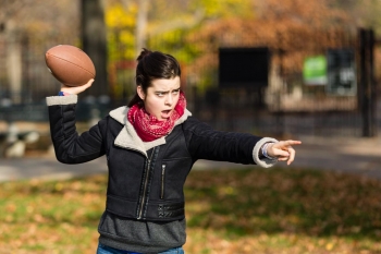 Daughter Throwing a Football