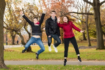 Siblings Jumping in Central Park