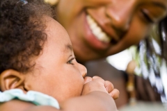 Infant and mother with dreadlocks