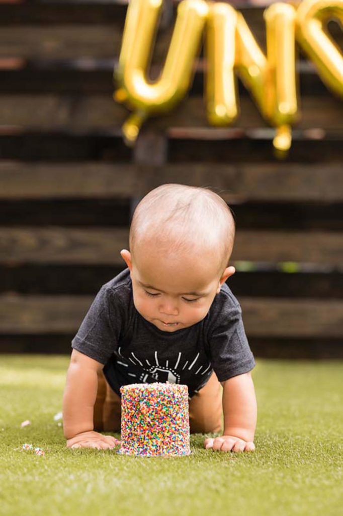 Baby-takes-close-look-at-birthday-cake
